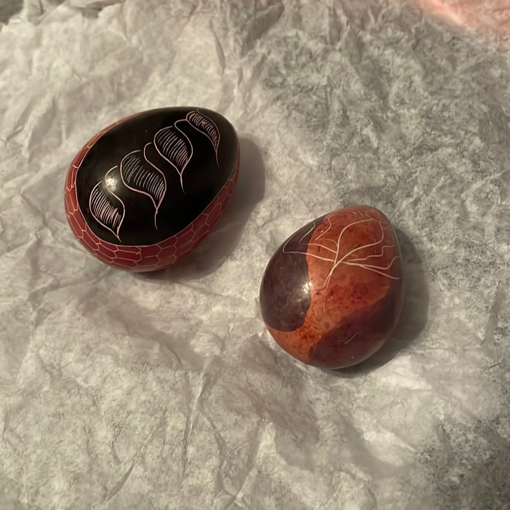 Two hand painted stone eggs